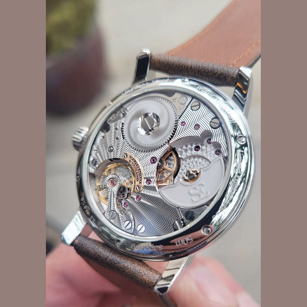 Schwarz Etienne Roma Synergy GMT Salmon Dial by Kari Voutilainen