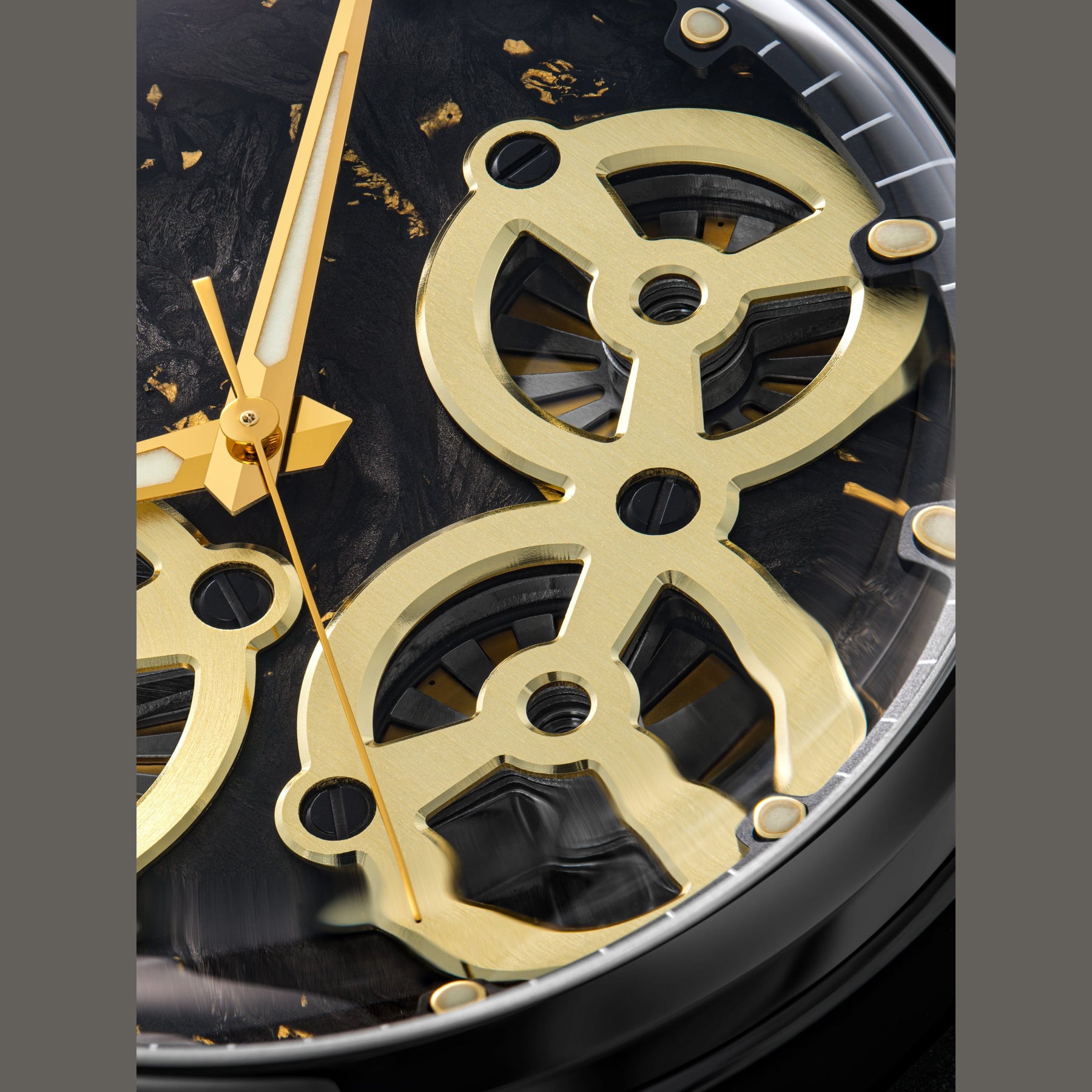 Close-up of a gold watch mechanism with black background