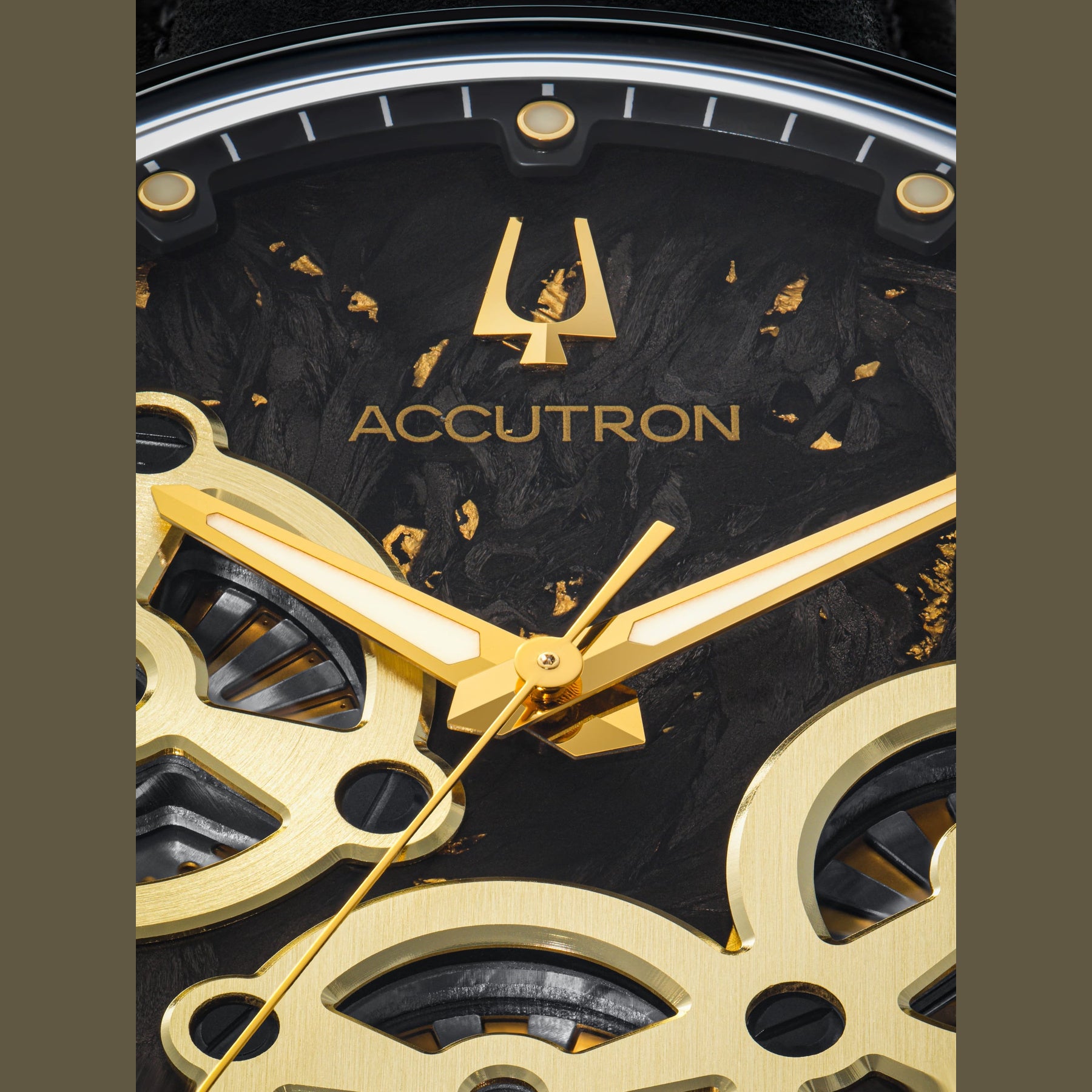 Accutron watch face with gold accents and black background