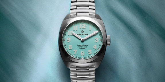 Bremont Terra Nova with a Turquoise face and silver case on a turquoise background