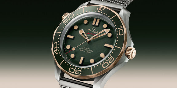 Omega watch with green dial and bronze accents on a gradient background