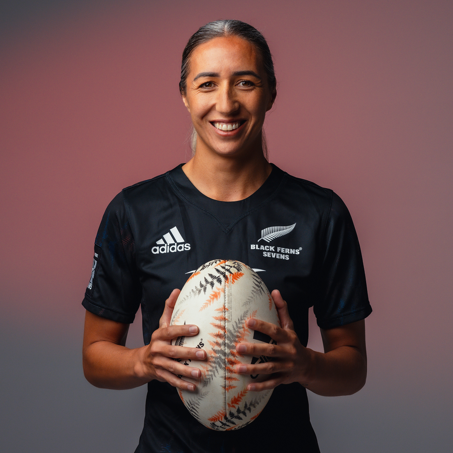 Sarah Hirini holding a Rugby Ball